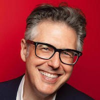 Man with glasses smiling