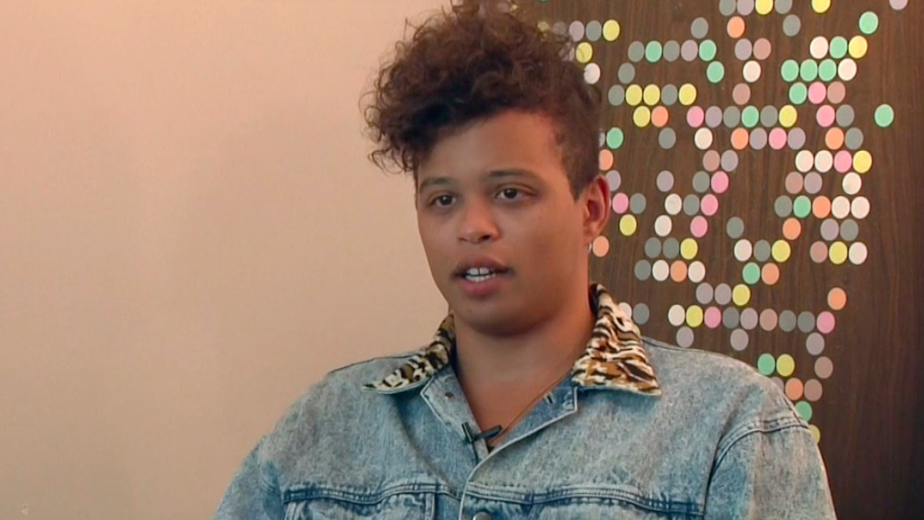 Reina Gossett in a denim jacket with a tiger fur collar