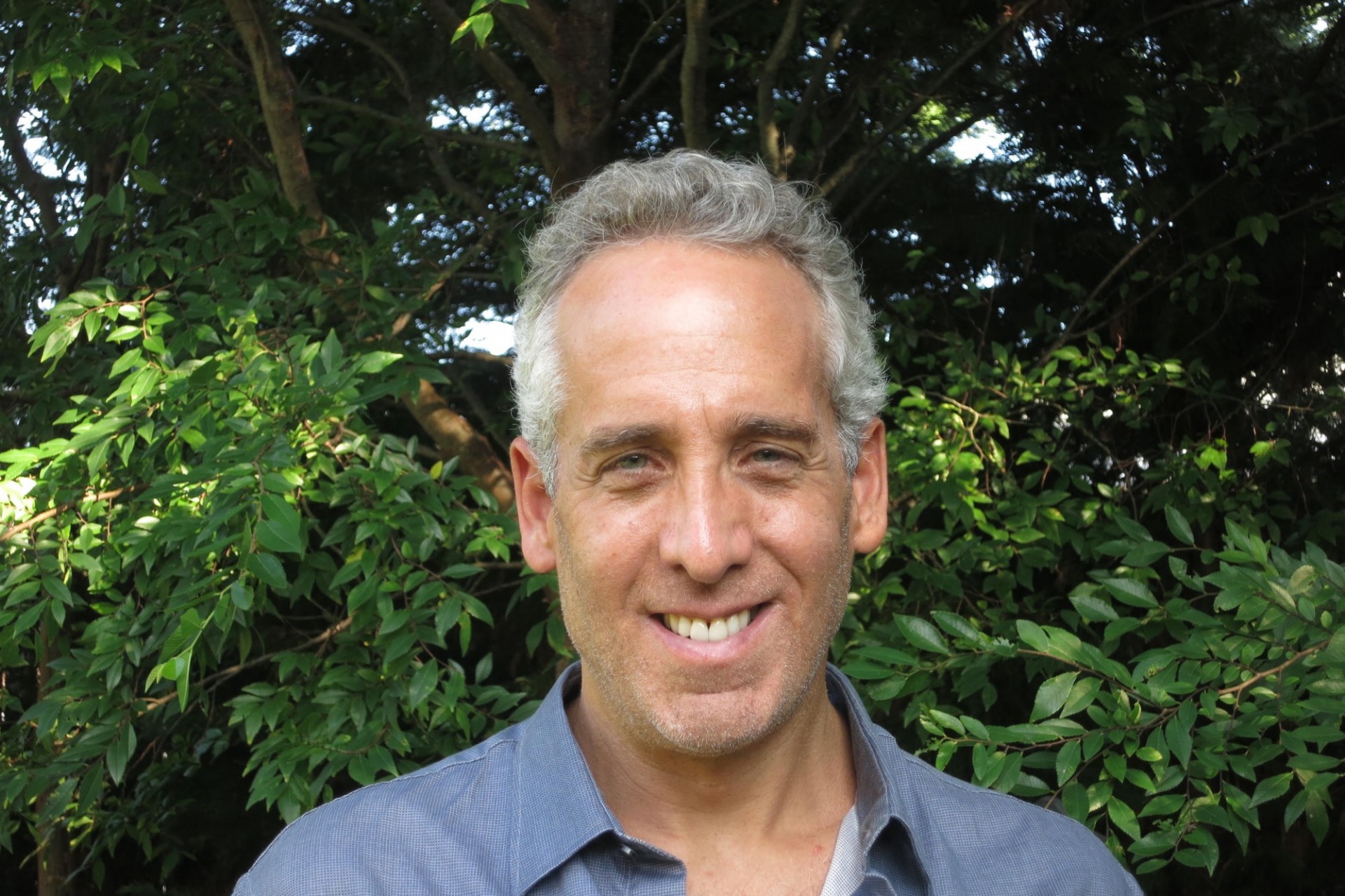 Stuart Gottlieb standing in front of trees