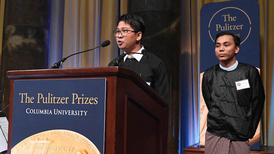 Reuters reporters Wa Lone and Kyaw Soe Oo at a podium during the Pulitzer Prizes ceremony.