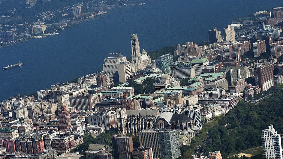 Aerial view Columbia's Morningside campus on a clear day, with a view of the Hudson River