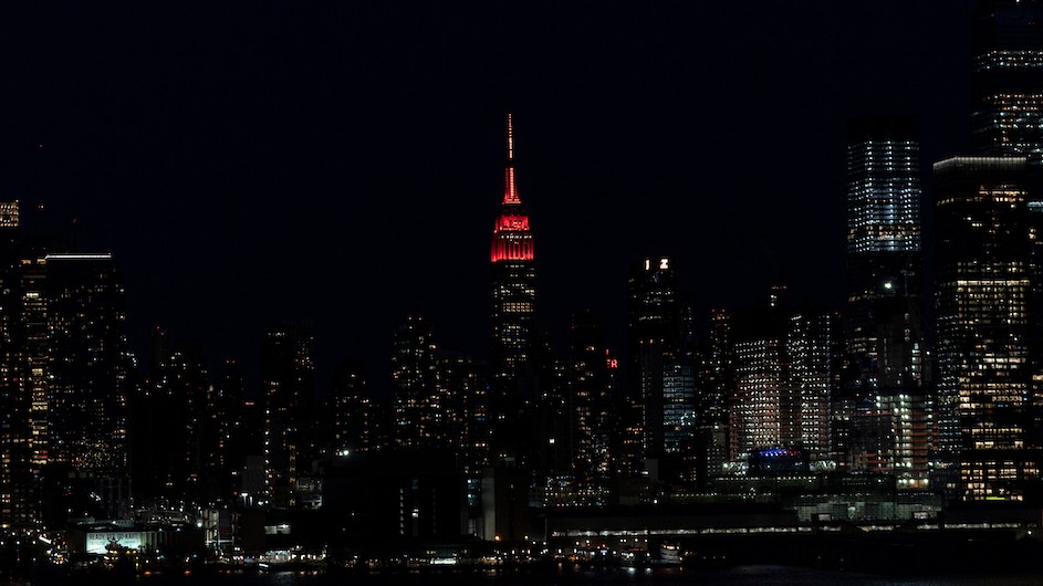 Empire State Building at night lit red