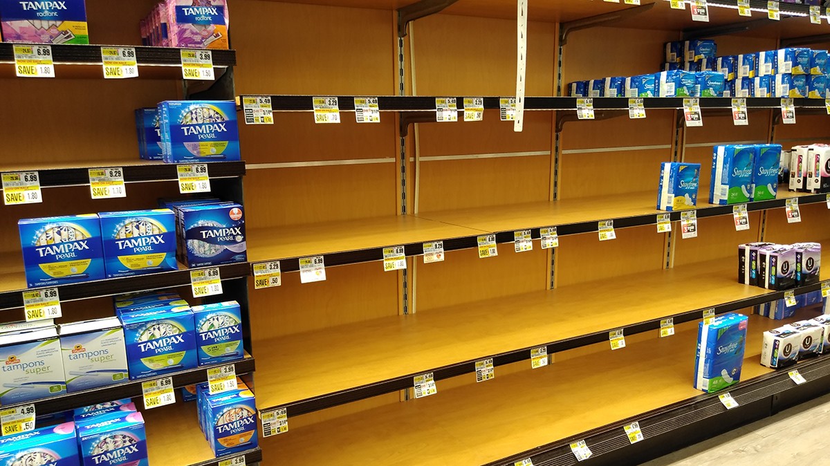 Empty store shelves where menstruation products would normally be sold.