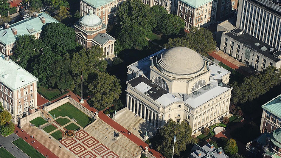 Aerial view of Low Library, a white stone, dome building on Columbia University's Morningside campus