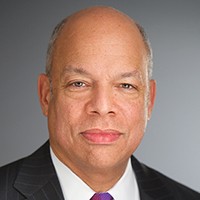 Jeh Johnson Headshot of a man with short gray hair in a dark suit and tie with a white shirt.