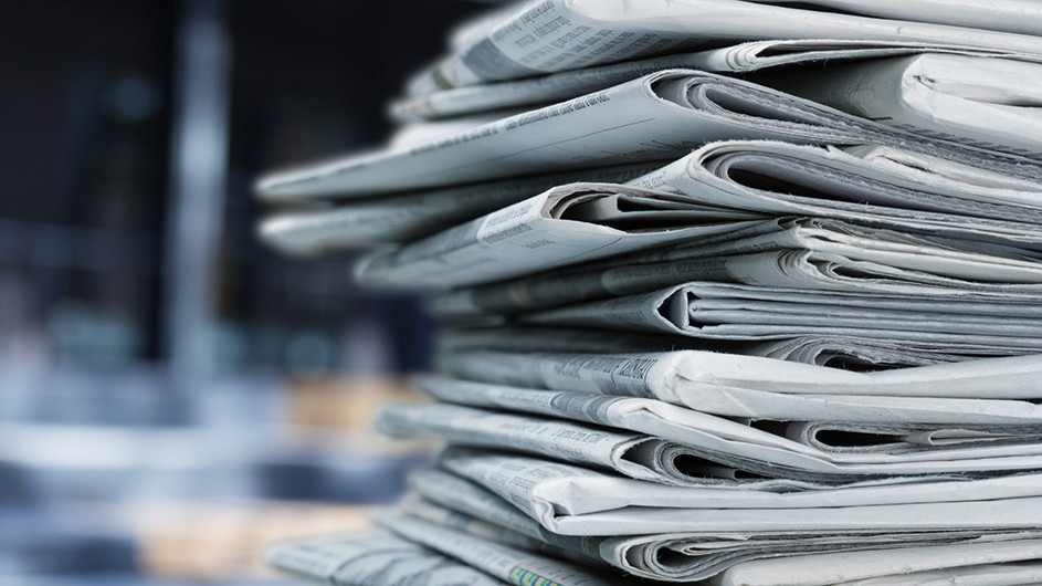 A stack of piled up newspapers