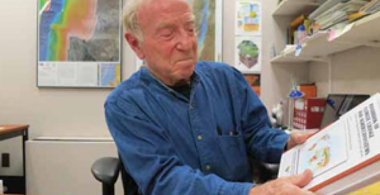 Daniel Hillel reviews "Handbook of Climate Change and Agroecosystems," which he co-edited with Cynthia Rosenzweig Image credit: Kevin Krajick Man in business shirt with gray hair proudly looking down at a textbook