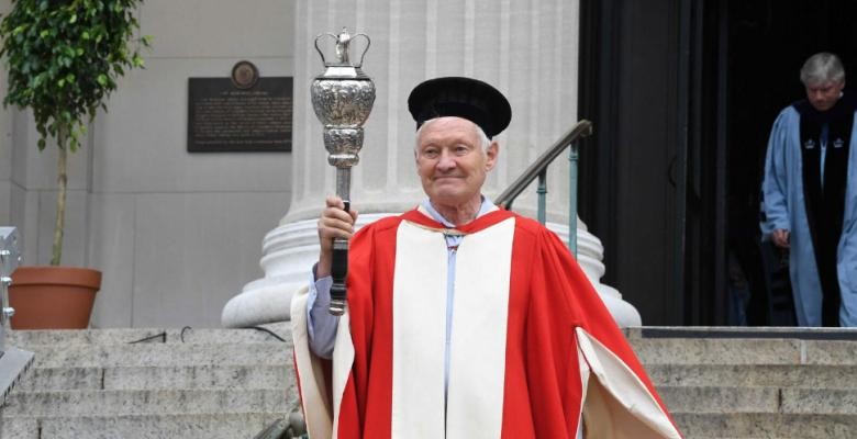 Nobel Laureate Joachim Frank carried the ceremonial mace for this year's Commencement. Photo by Eileen Barroso Joachim Frank in commencement ceremonial robes carrying the mace