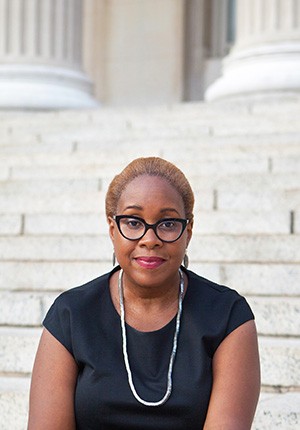 Mabel Wilson sits on the steps of Low Library