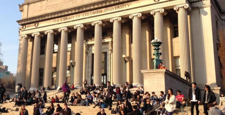 Students sit in front of Low Library
