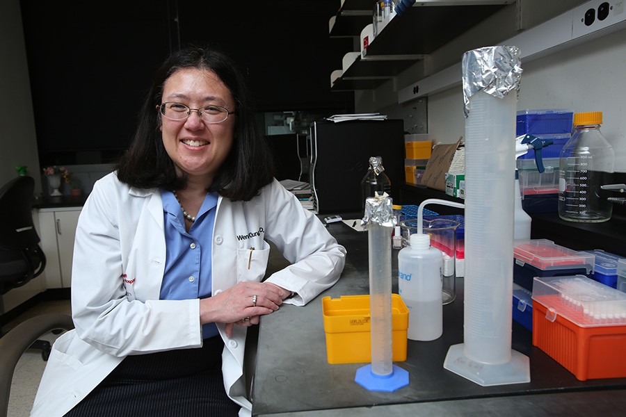 Wendy Chung sitting at her laboratory 
