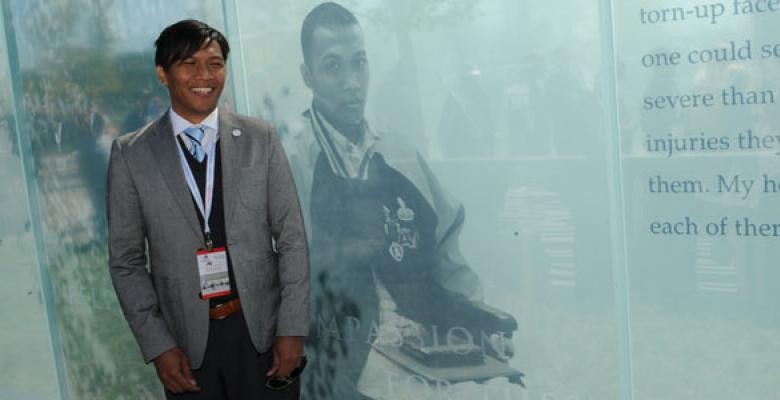 Joseph Bacani stands in front of his portrait at the American Veterans Disabled for Life Memorial. Photo Courtesy AVDLM/C.J. Heatley Joseph Bacani