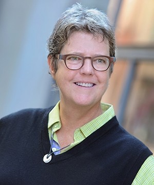 Katherine Franke in glasses with light green collared shirt