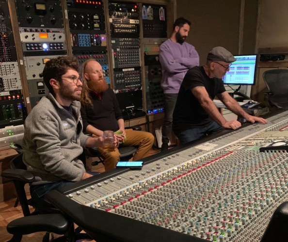 Treatman (far left) recording "Rags Parkland Sings the Songs of the Future." Men sitting by the recording machine in a studio.