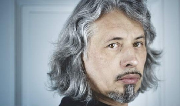 2020 Super-NOS winner Vladimir Sorokin. A man with goatee and long grey hair looking into the camera
