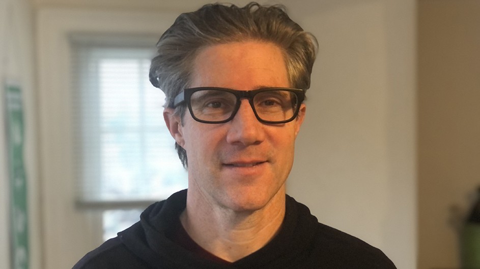 To unwind, Barnard Professor Aaron Passell turns to literary and speculative fiction on urban and environmental issues. A man wearing glasses and a dark shirt looks into the camera: Allen Passell.