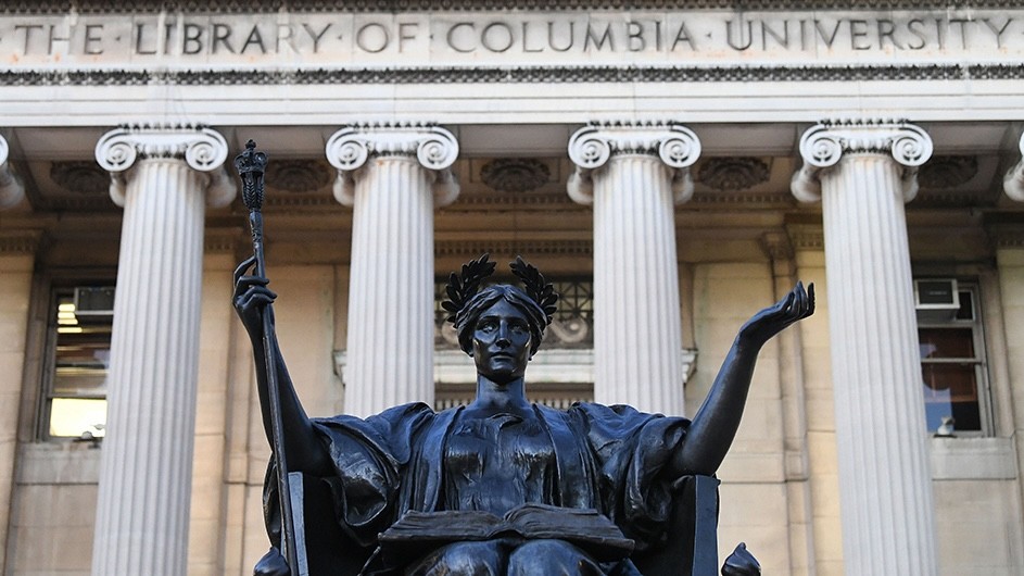 Alma Mater with Low Library in the background.