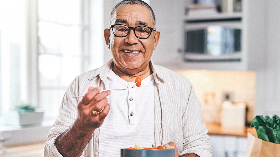 A person holding a salad.