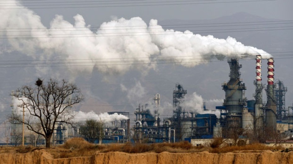 Smoke and steam rise from a coal processing plant in Hejin, central China's Shanxi province, Nov. 28, 2019. (AP) Smoke and steam coming out of chimneys of a coal processing plant.