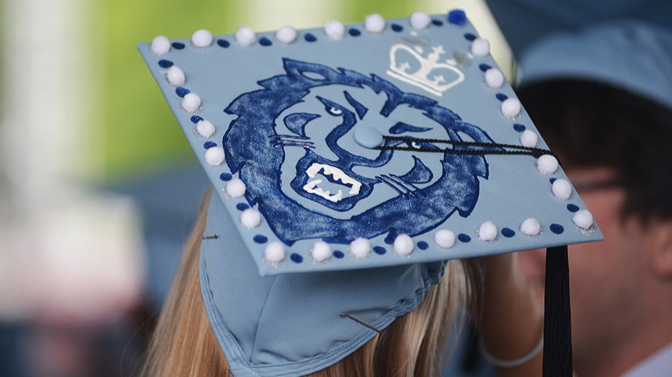 A graduate's mortar board decorated with the Columbia crown and lion
