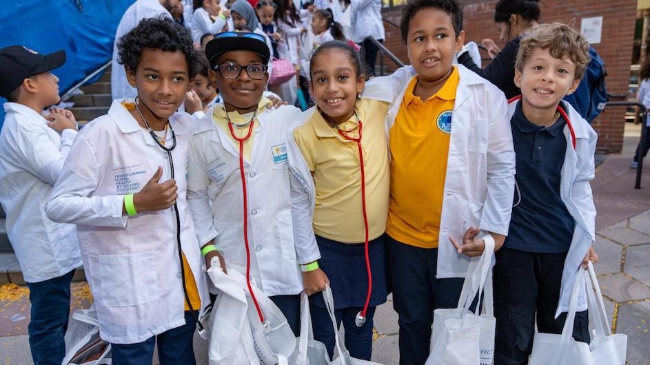 Kids visiting Columbia University Irving Medical Center's Curiosity Minds Science Zone conducted hands-on science experiments and received their very own lab coats.