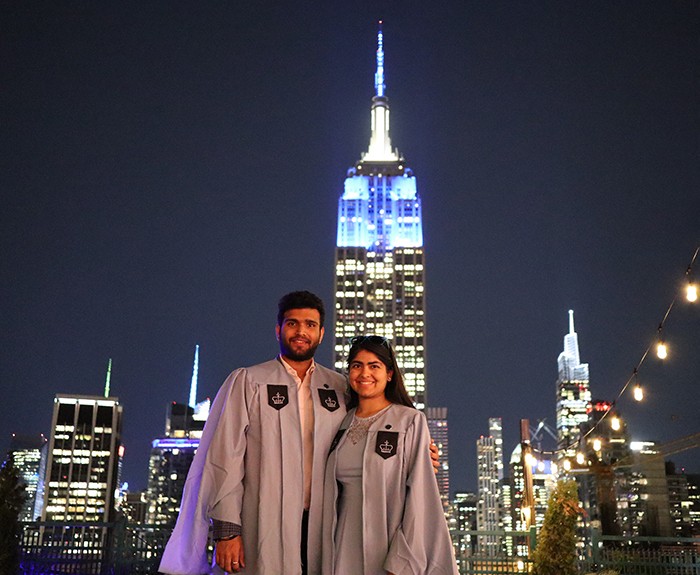 Photo by Chandan Suri (SEAS'23) & Gursifath Bhasin (SEAS'23). The Empire State Building image ® is a registered trademark of ESRT Empire State Building, L.L.C. and is used with permission. Two students stand in front of the Empire State Building