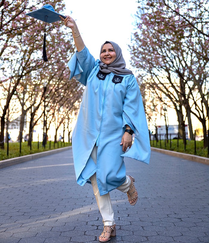 Photo courtesy Khloud Shuqair (SIPA'23). Khloud Shuqair (SIPA'23) poses on College Walk in regalia.