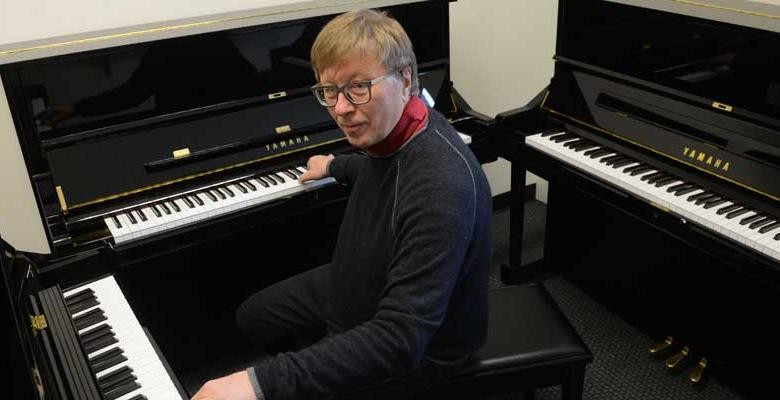 Georg Friedrich Haas with his three upright Yamaha pianos, one tuned according to standard pitch and the other two to pitches smaller than a half step to accommodate his own microtonal compositions and his teaching.