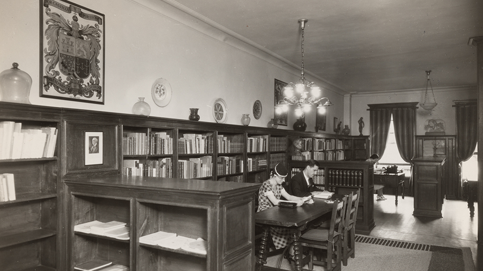 A woman reads in Casa Hispanica. 