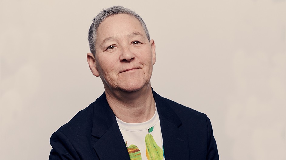 Jack Halberstam: smiling and wearing a printed T-shirt under a dark jacket.