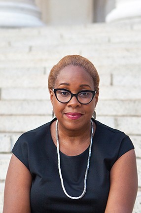 Professor Mabel O. Wilson is the director of Columbia's Institute for Research in African-American Studies. A woman wearing eyeglasses, a necklace, and a dark top.