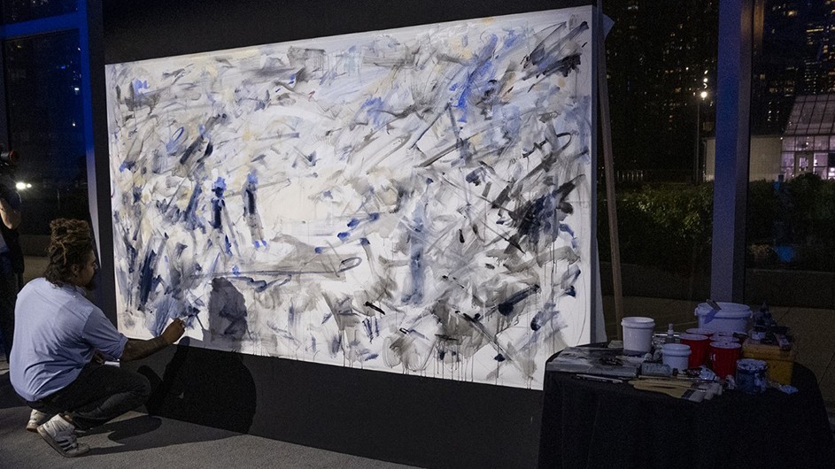 School of the Arts MFA student Aristotle Forrester creating a painting at the first Obama Foundation Democracy Forum. Photo: Obama Foundation. Columbia University student Aristotle Forrester creates a work of art at Obama Foundation event.