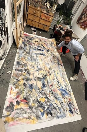 Columbia University MFA student Aristotle Forrester with the Obama Foundation work in his studio