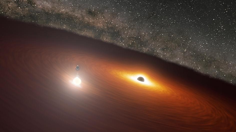 An illustration of two massive black holes in the OJ 287 galaxy. (Credit: NASA/JPL-Caltech) An illustration of two massive black holes in the OJ 287 galaxy.