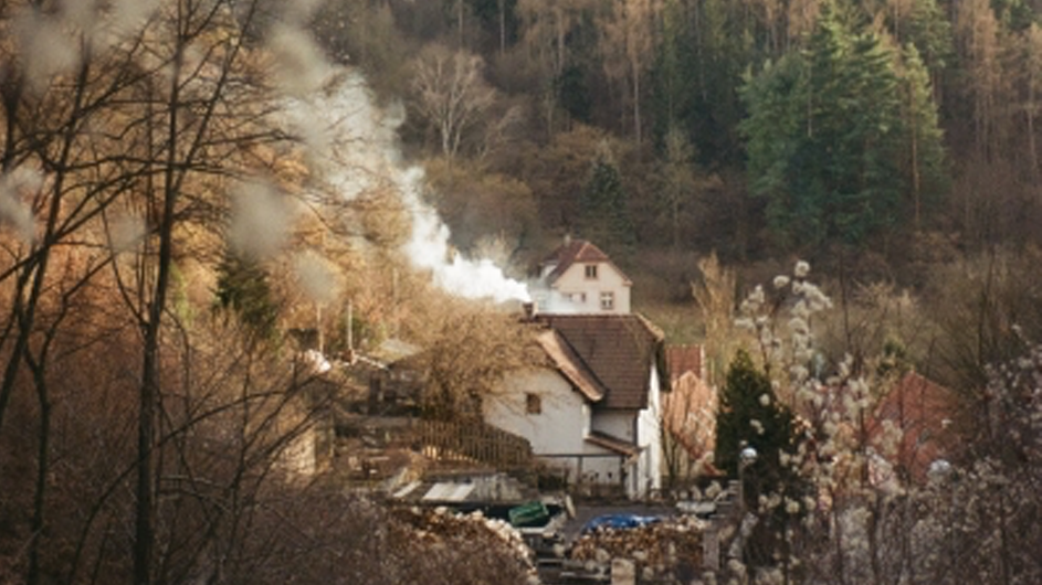 Smoke from a chimney in a village. 