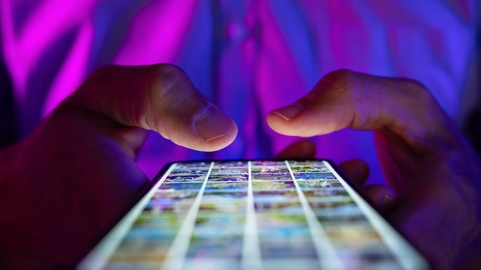 Close-up of a person using a smartphone.