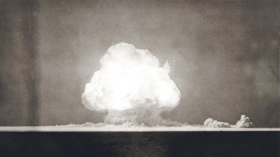 An image of the "Trinity test," the first atomic explosion, on July 16, 1945. The photograph was taken nine seconds after the initial detonation. The test took place in New Mexico. The First Atomic Explosion on July 16, 1945. Photograph taken at 9 seconds after the initial Trinity detonation shows the Mushroom cloud. Manhattan Project, World War 2. Alamogordo, New Mexico.