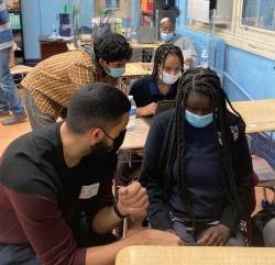 Columbia graduate students Navin Sridhar (top left) and Manvir Grewal (bottom left) mentoring Democracy Prep Harlem High School students during Coding Club 