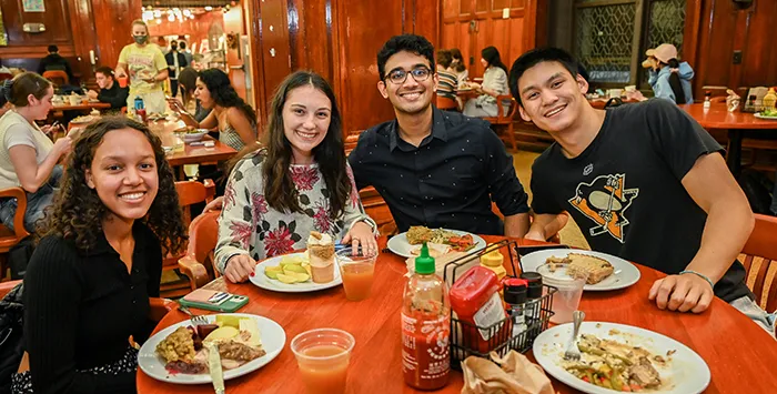 Friends join together in John Jay over turkey dinner. 