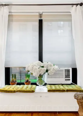 The Cozy, a product made by Radiator Labs, fits over radiators in steam-heated buildings to redistribute waste heat.