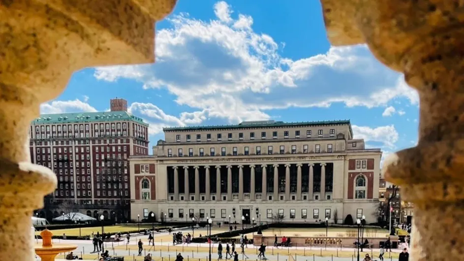 A view of South Lawn and Butler library through balcony at Low Library. 