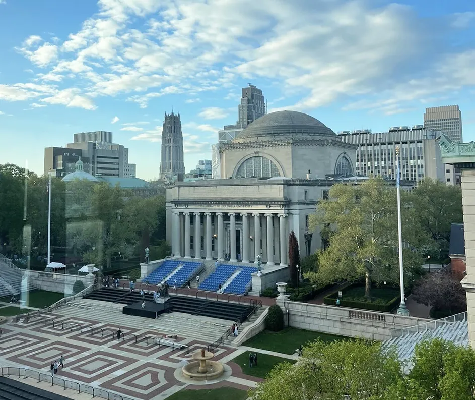 Low Library with blue seats in front on its steps getting ready for graduation