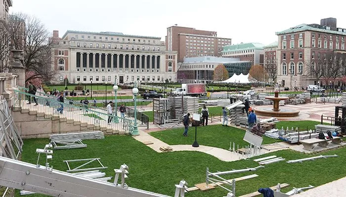 Workers and materials are on Low Plaza with a view of Butler Library behind