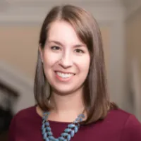 Headshot of a woman with a burgundy shirt, Elaine Smolen
