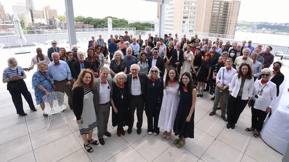 Eric Kandel with friends and family wearing red bow ties