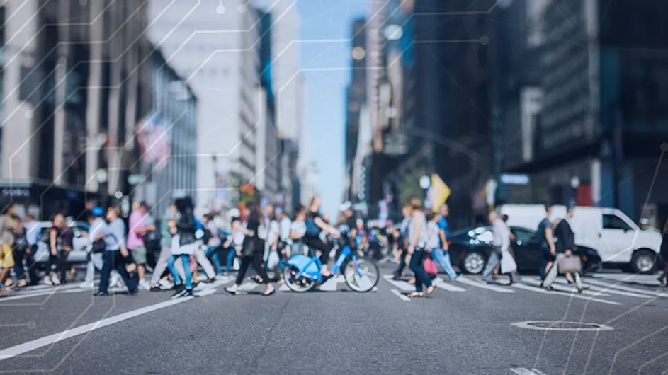 Bikes and pedestrians on a city street.