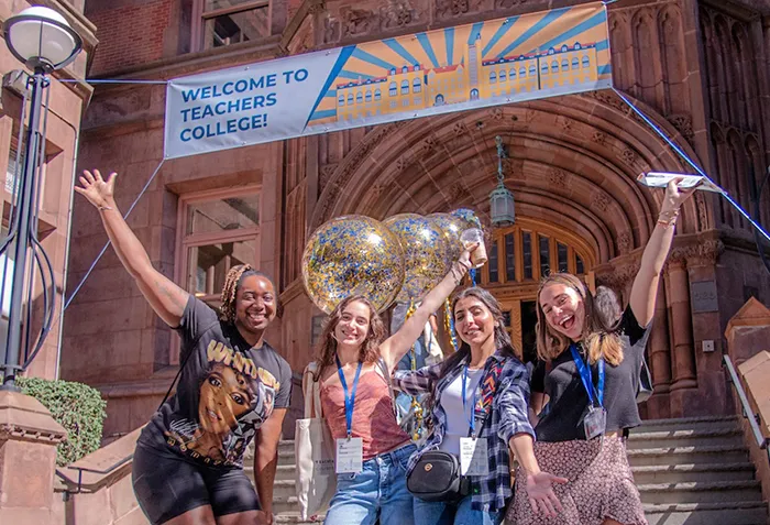 Students pose in front of Zankel Hall at Teachers College during Orientation. Photo by Kevin Chiu.