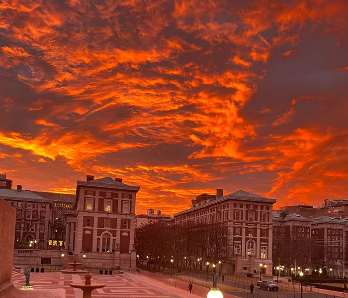 A red and orange sunset over Morningside Height campus. 