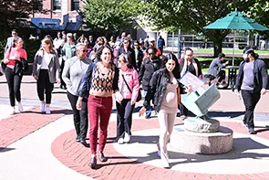 Staff and faculty walking around Columbia's Morningside campus as part of the Uptown/Downtown University Step Challenge.