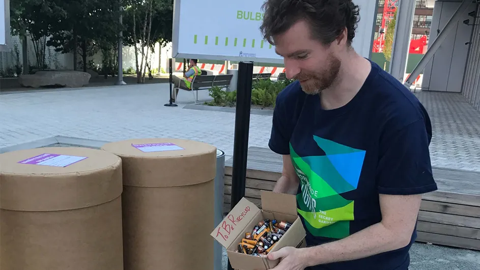 A man with a box of recycling
